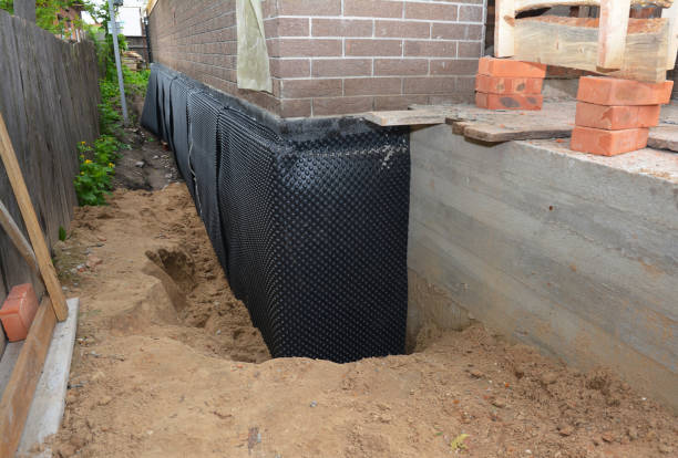 Happy homeowners after waterproofing job in Alabaster